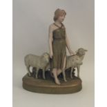 A Royal Dux figure of a child with sheep. Approx.