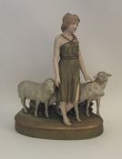 A Royal Dux figure of a child with sheep. Approx.