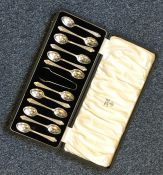 A boxed set of twelve silver coffee spoons togethe