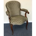 An upholstered armchair with padded arm rest to ca