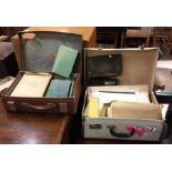 A suitcase containing maps, brass medals and books