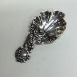 A good scroll and floral decorated cast silver cad