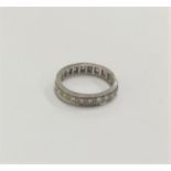 A diamond full eternity ring in carved setting. Fi