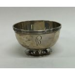 A heavy circular silver sugar bowl on spreading ba