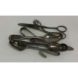 A quantity of various silver cutlery and tongs. Va