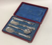 A French silver four piece preserve set with flute