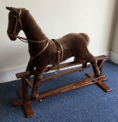 An old rocking horse. Est. £20 - £30.