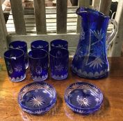 An attractive blue glass lemonade set with flower