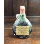A vintage 1934 bottle of 'Vénérable Armagnac' reta