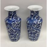 A pair of Chinese blue and white vases with taperi