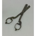A pair of Continental silver cast scissors decorat