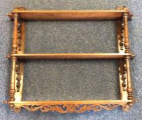 A mahogany wall bracket with turned decoration. Es