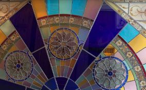 A massive mahogany framed stained glass panel deco