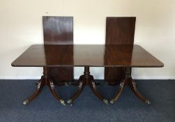 A good Georgian mahogany three pillar dining table