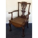 A Georgian mahogany commode chair on ball and claw