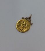 A 1914 sovereign mounted as a pendant. Approx. 8.7