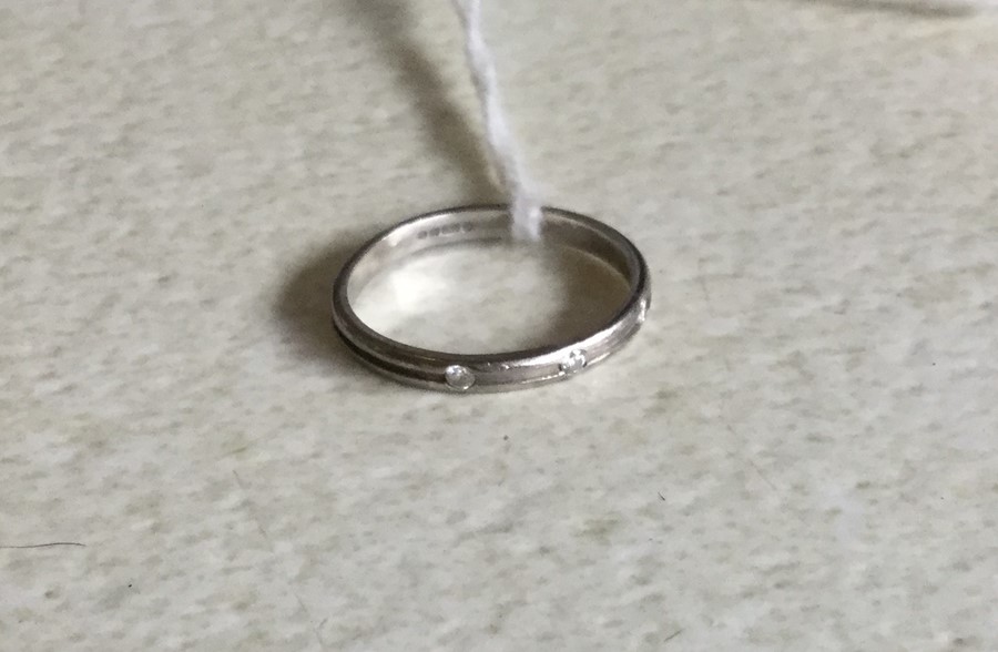 A platinum three stone gypsy set ring. Approx. 1.8