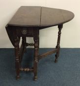 A Georgian mahogany drop leaf table on stretcher b