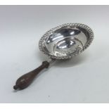 An Antique silver wine funnel with turned handle.