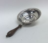 An Antique silver wine funnel with turned handle.