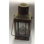 A copper mounted oil lamp of rectangular form with