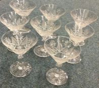 A set of eight cut glass tapering champagne glasse