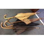 A selection of four Antique umbrellas. Est. £20 -
