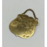 A good quality silver gilt Hebrew shield on suspen