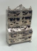 An unusual miniature silver bureau bookcase profus