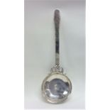 A massive Swedish silver ladle with engraved decor