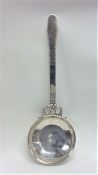 A massive Swedish silver ladle with engraved decor