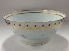 CHAMBERLAINS: A large white pottery fruit bowl dec