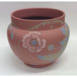 LANGLEY: A decorative jardiniere in terracotta wit