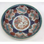 A large Chinese blue and white bowl decorated with