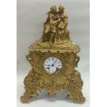 A French brass mantle clock with white enamel dial