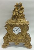 A French brass mantle clock with white enamel dial