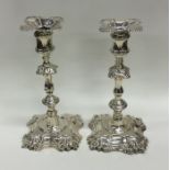 A pair of good Georgian cast silver candlesticks o