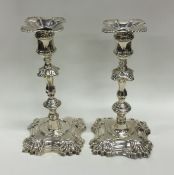 A pair of good Georgian cast silver candlesticks o
