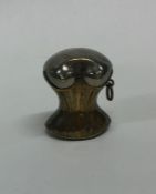 An unusual brass mounted vesta in the form of a co