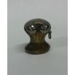 An unusual brass mounted vesta in the form of a co