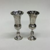 A pair of Continental silver spill vases with gilt