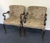 A pair of Edwardian mahogany chairs with cabriole