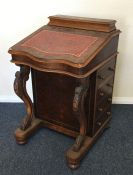 A Victorian mahogany hinged top Davenport with fit