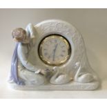 LLADRO: A cased clock decorated with swans and fig