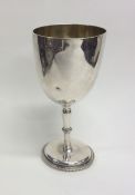 A plain Victorian silver goblet. London. By HH. Ap