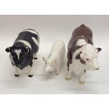 A Beswick model of a pig together with two Beswick