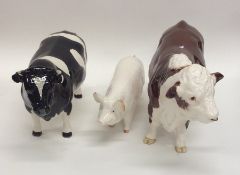 A Beswick model of a pig together with two Beswick