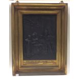 A large rectangular cast iron and brass framed pic
