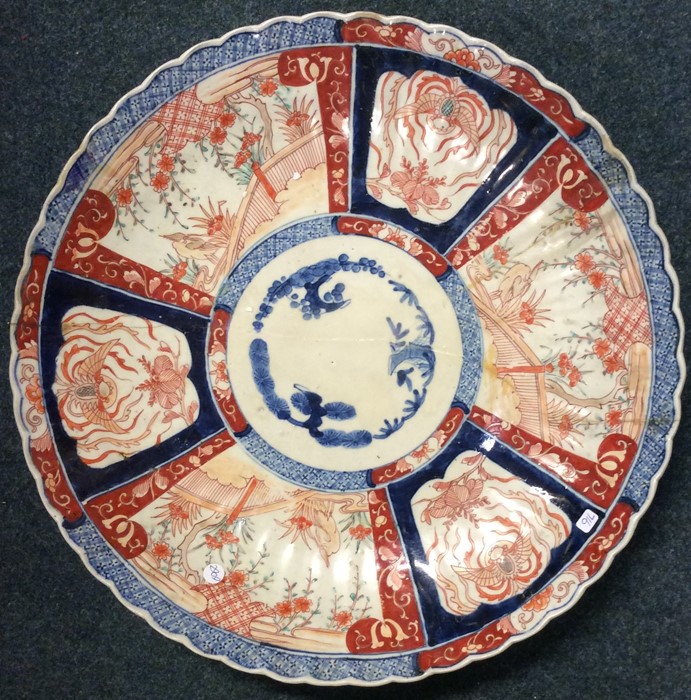 A large Chinese charger decorated with flowers and