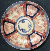 A large Chinese charger decorated with flowers and